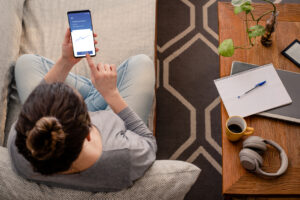 Woman using investment mobile app.