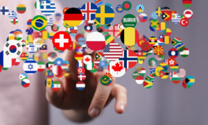 A 3D rendering of national flags as buttons, with a hand reaching.