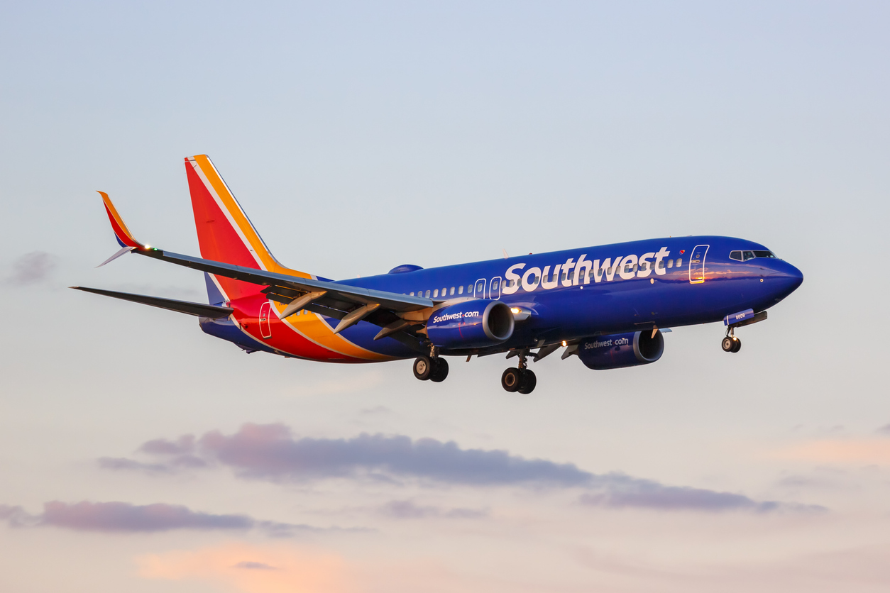 Southwest airplane landing at sunset at Dallas Love Field airport (DAL).