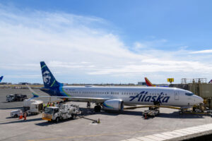 Alaska Airlines plane parked at the gate at an airport
