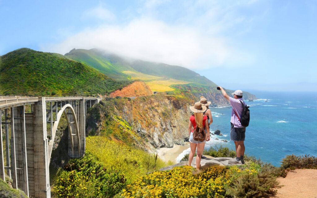 Family looking at beautiful summer mountains landscape on hiking trip